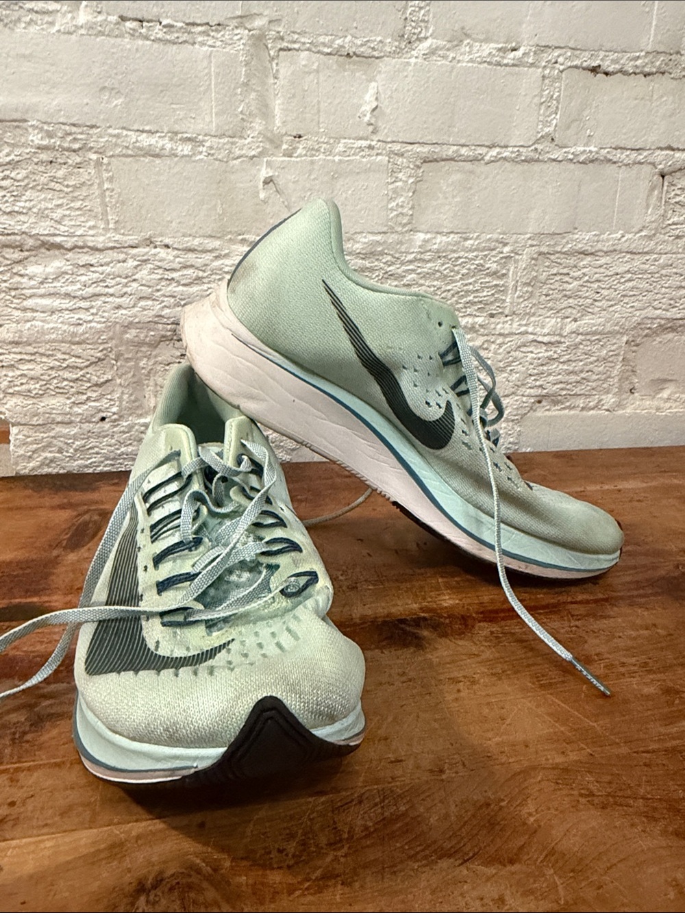 Nike Women's Light Mint Green Running Sneakers with Black Swoosh